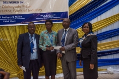 The-Bursar-Prof.-Adeyemi-and-Deputy-Bursar-presenting-award-to-RUN-Student-2