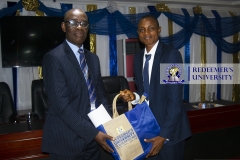 A-PRESENTER-AT-RECEIVING-A-SOUVENIR-AT-THE-TRAINING-ORGANISED-FOR-THE-SECRETARIES-OF-THE-UNIVERSITY-2022
